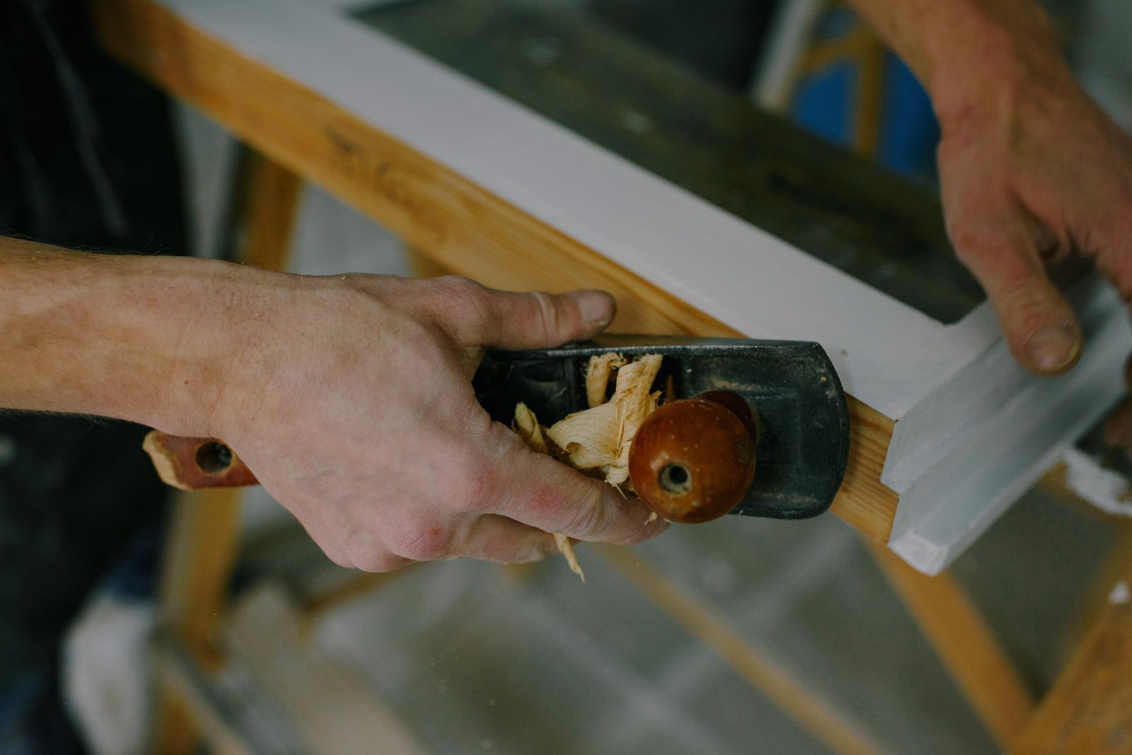 Hand tools shaping timber in the workshop