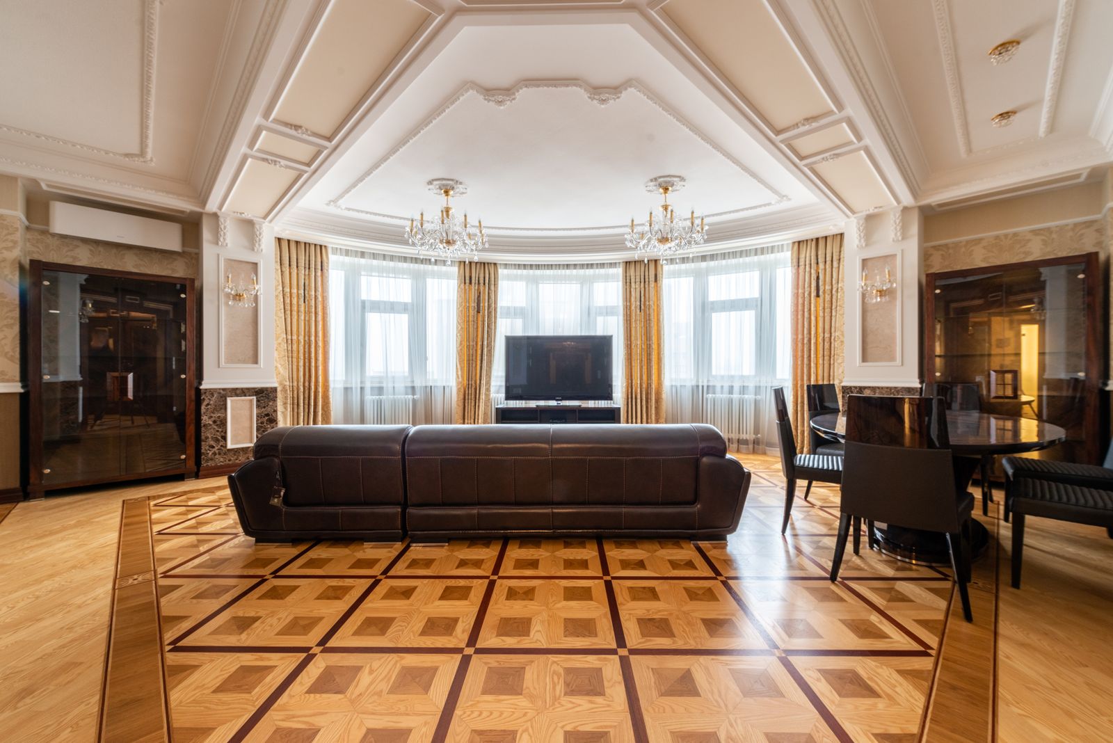 Villa living room with marquetry parquet and cabinetry