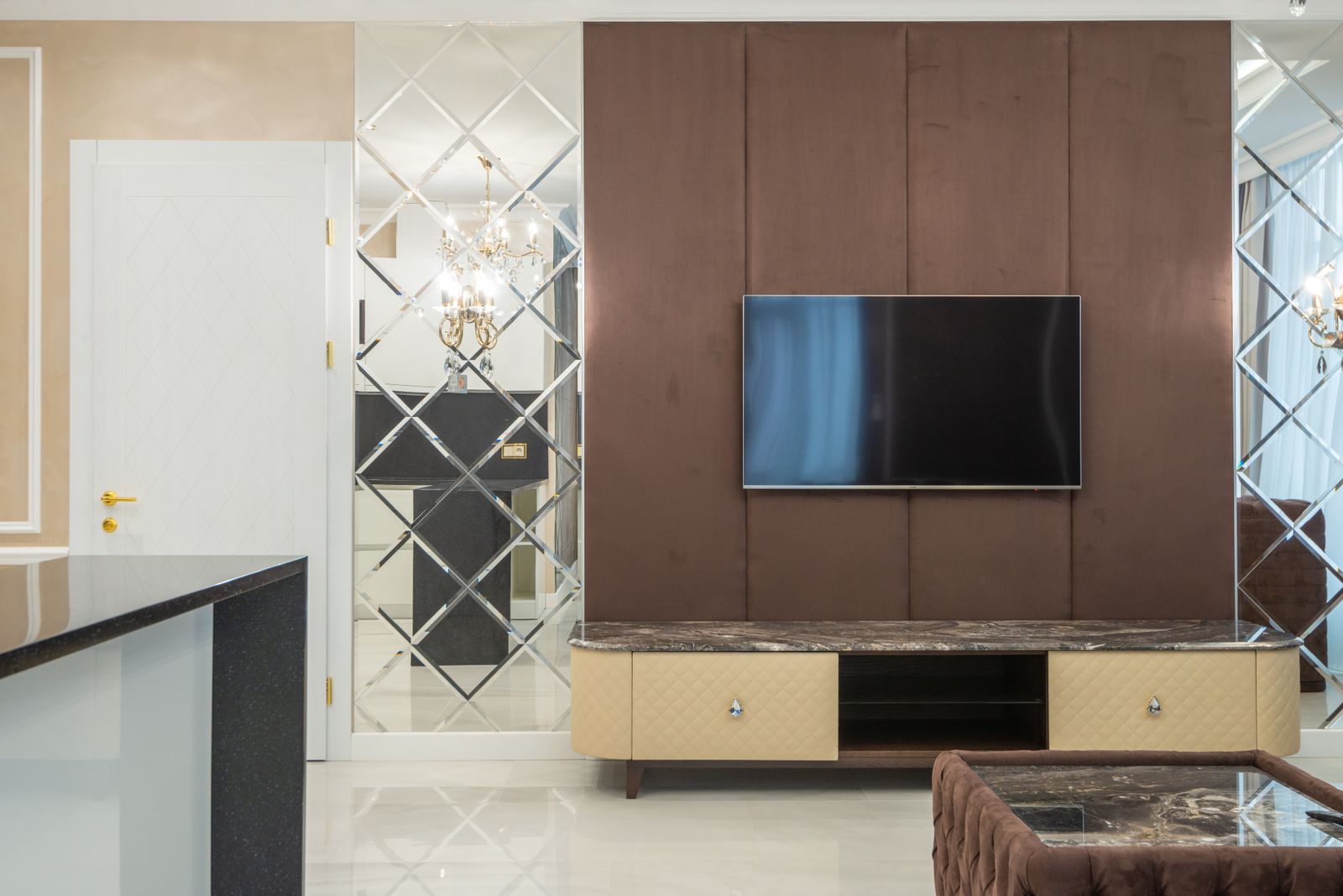 Upholstered TV wall with marble console